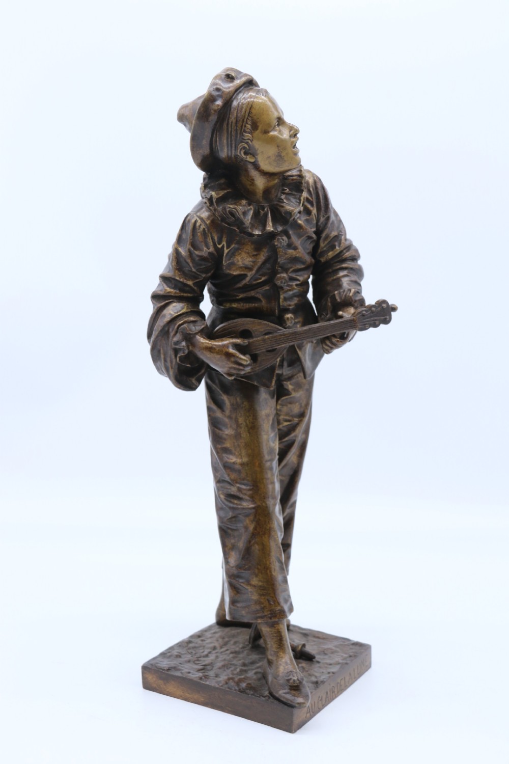 A fine French Bronze sculpture of a Pierrot singing and playing the lute by Bornet.  View II