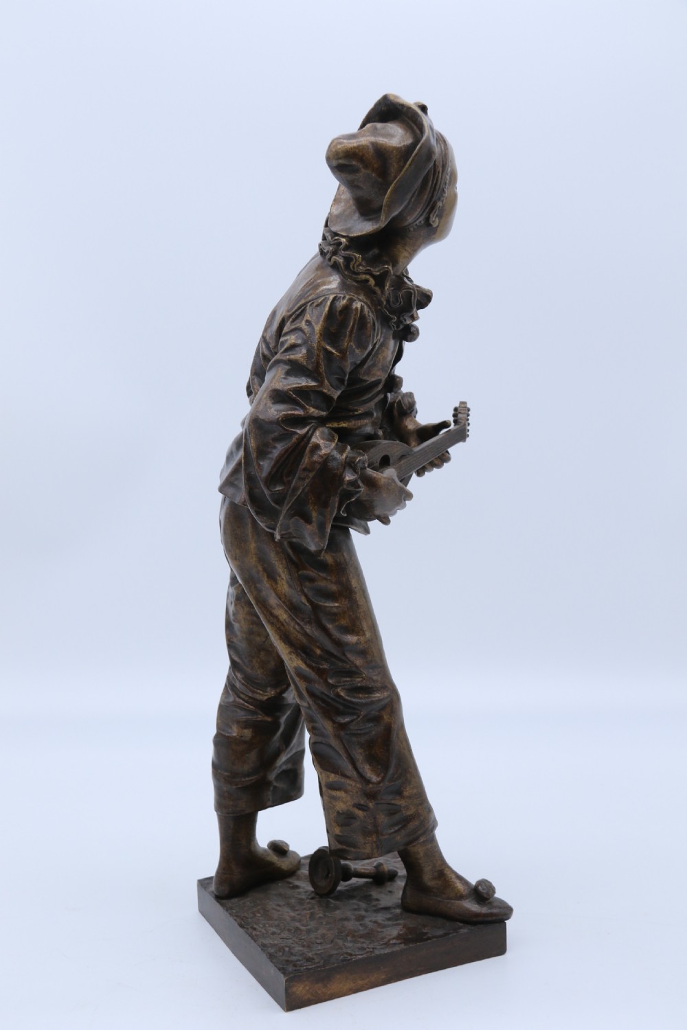 A fine French Bronze sculpture of a Pierrot singing and playing the lute by Bornet.  View III
