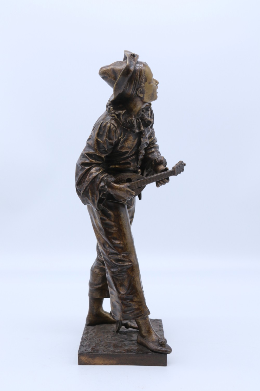 A fine French Bronze sculpture of a Pierrot singing and playing the lute by Bornet.  View IV