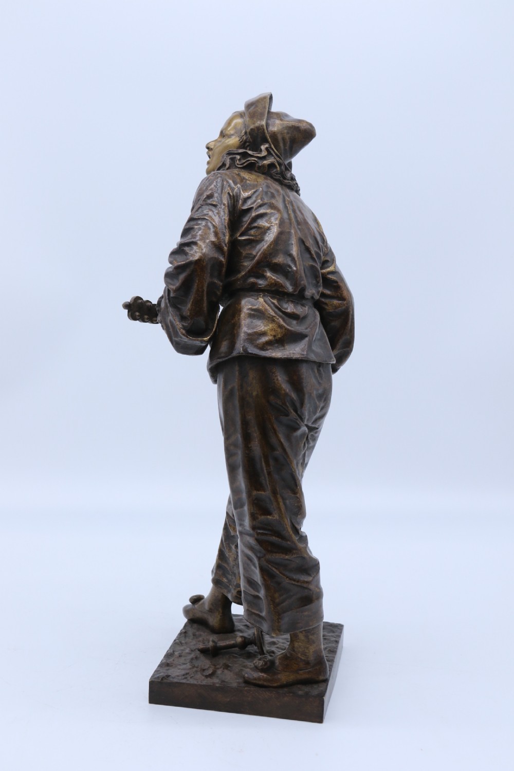 A fine French Bronze sculpture of a Pierrot singing and playing the lute by Bornet.  View VII