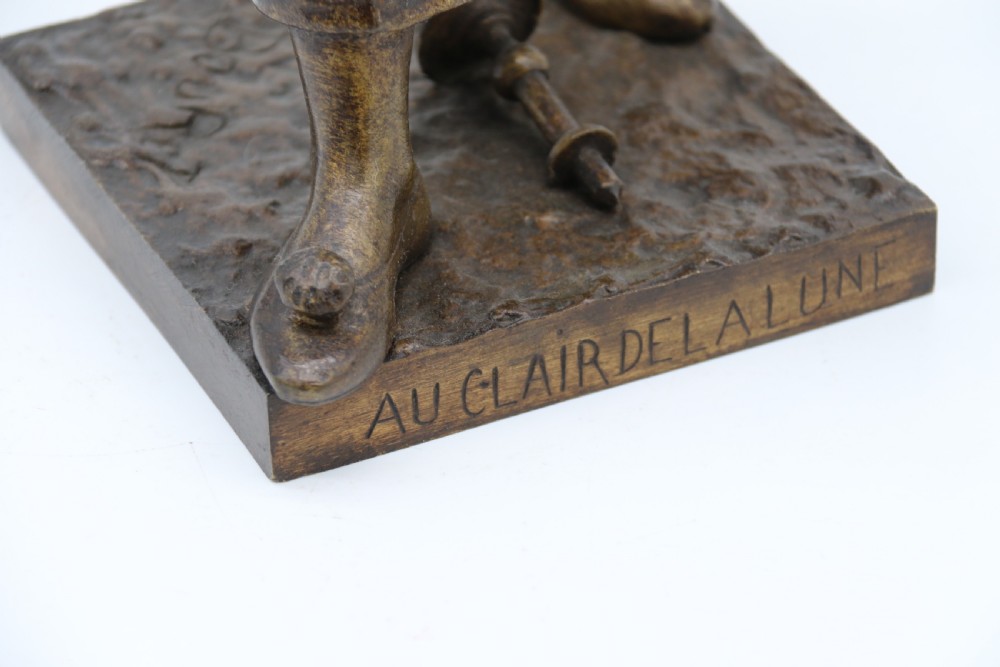 A fine French Bronze sculpture of a Pierrot singing and playing the lute by Bornet.  View XIII