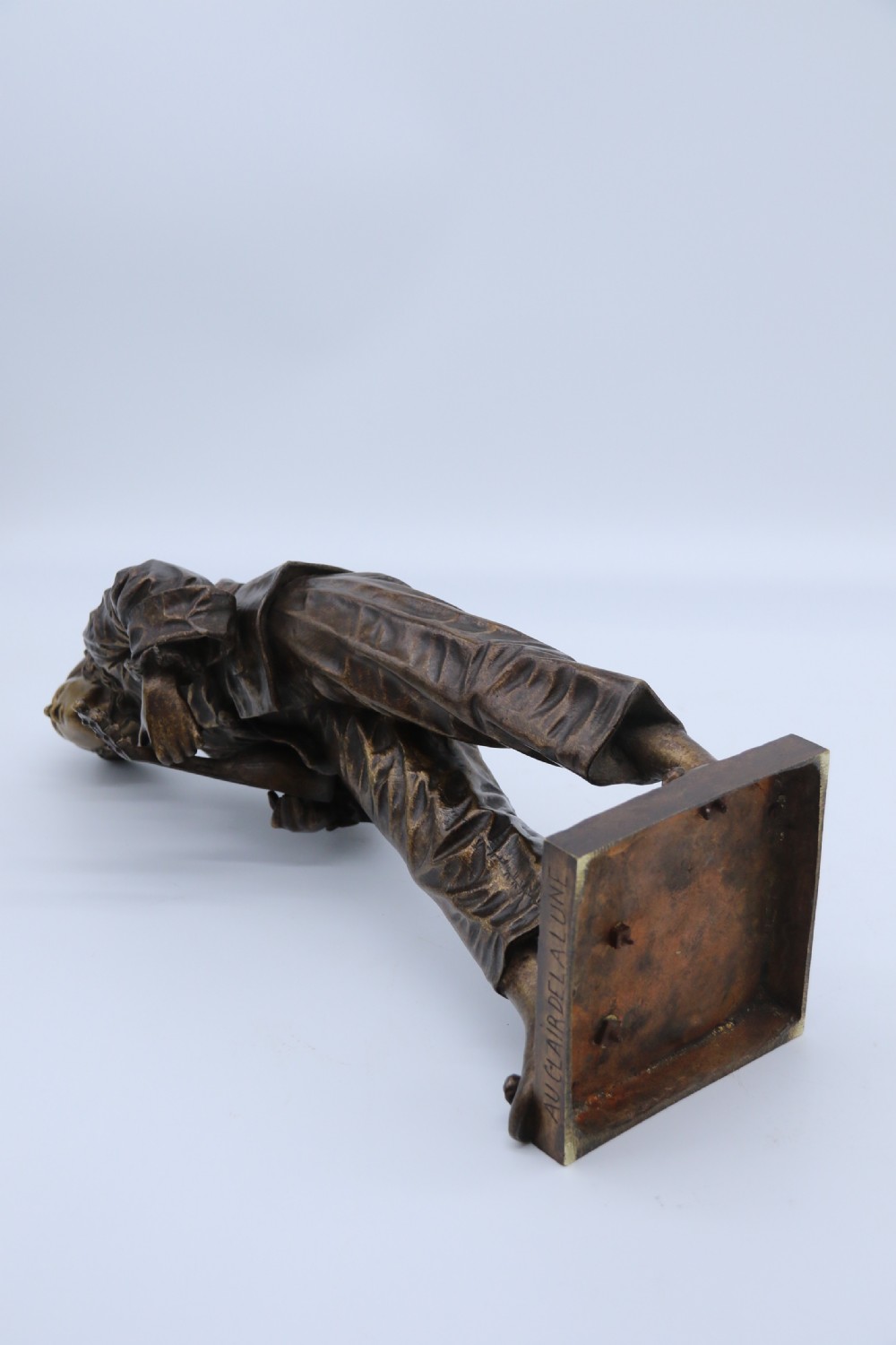 A fine French Bronze sculpture of a Pierrot singing and playing the lute by Bornet.  View XVII