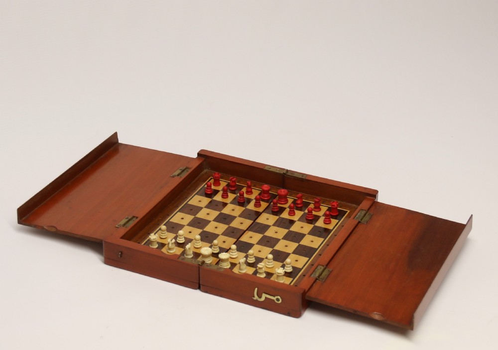 A rare and complete Victorian travelling chess set circa 1870