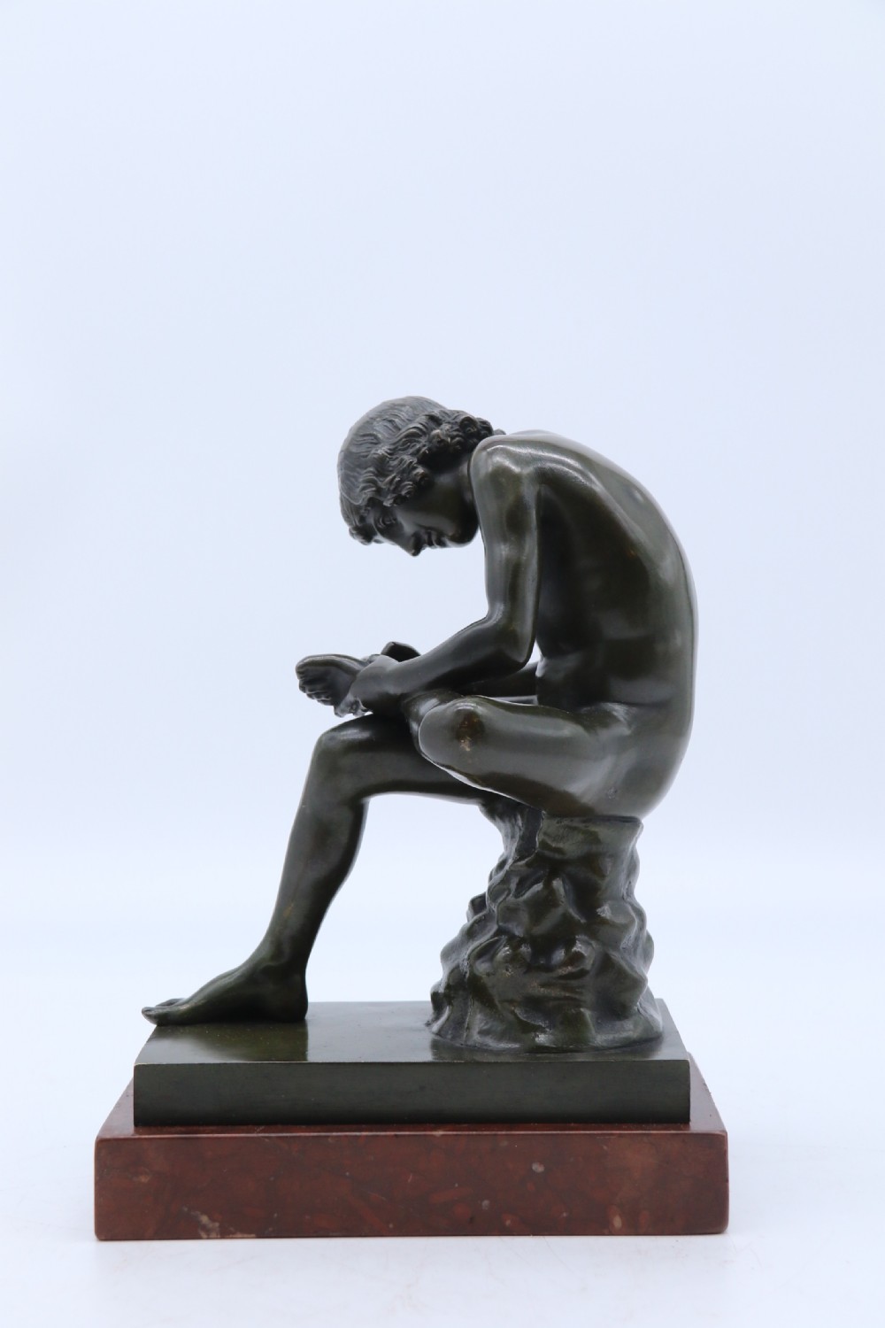A fine 19th century Italian Grand Tour bronze figure of Spinario, the boy with the thorn. View II