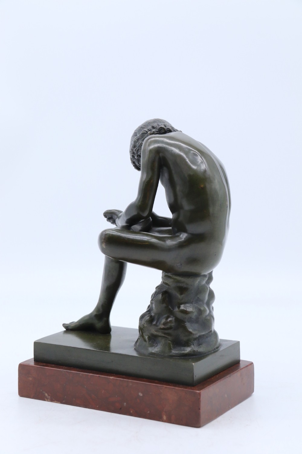 A fine 19th century Italian Grand Tour bronze figure of Spinario, the boy with the thorn. View III