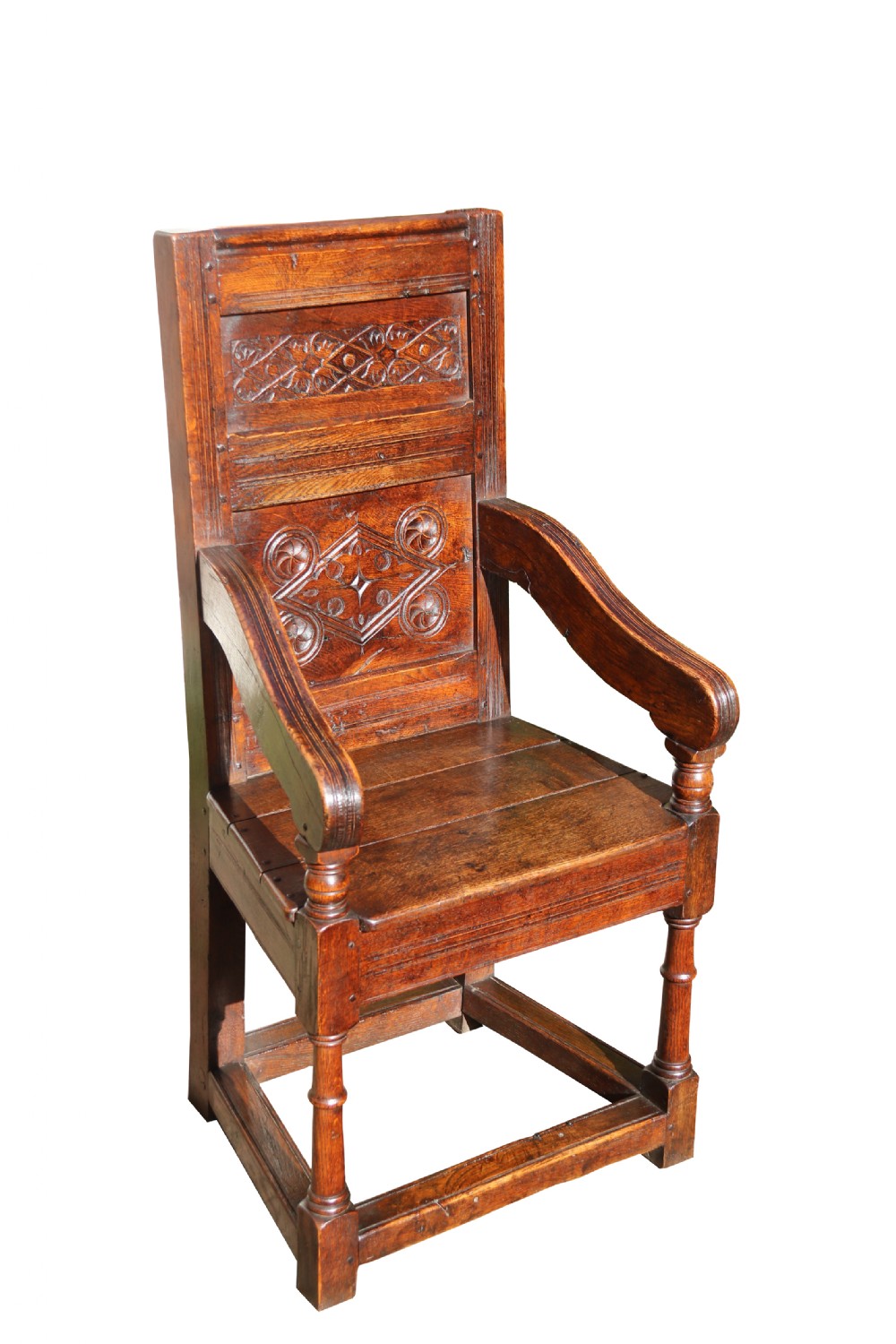A fine English oak panelled and moulded Wainscot Armchair.