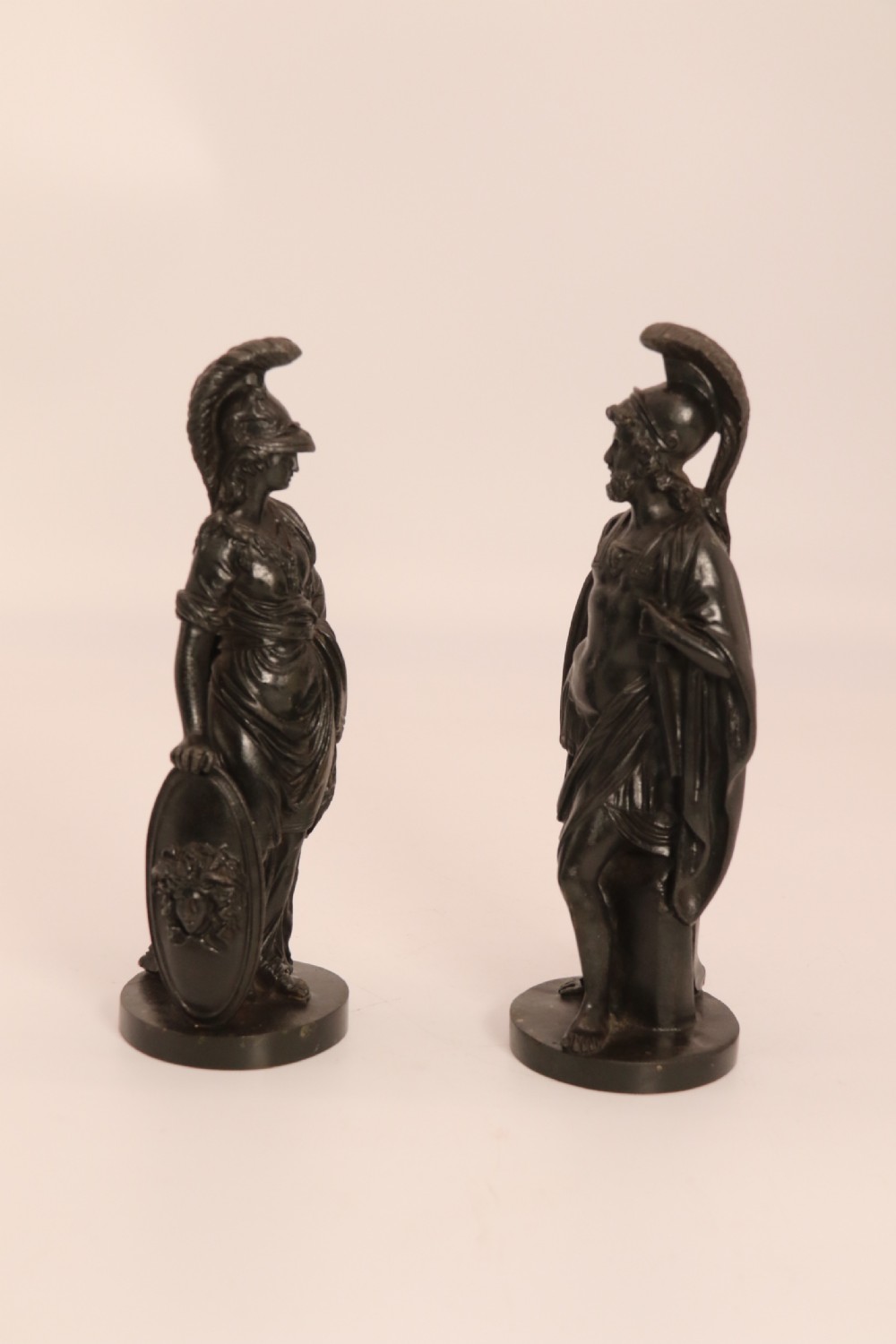 A pair of dark patinated bronze classical figures depicting Athena and Zeus on circular bases. View III