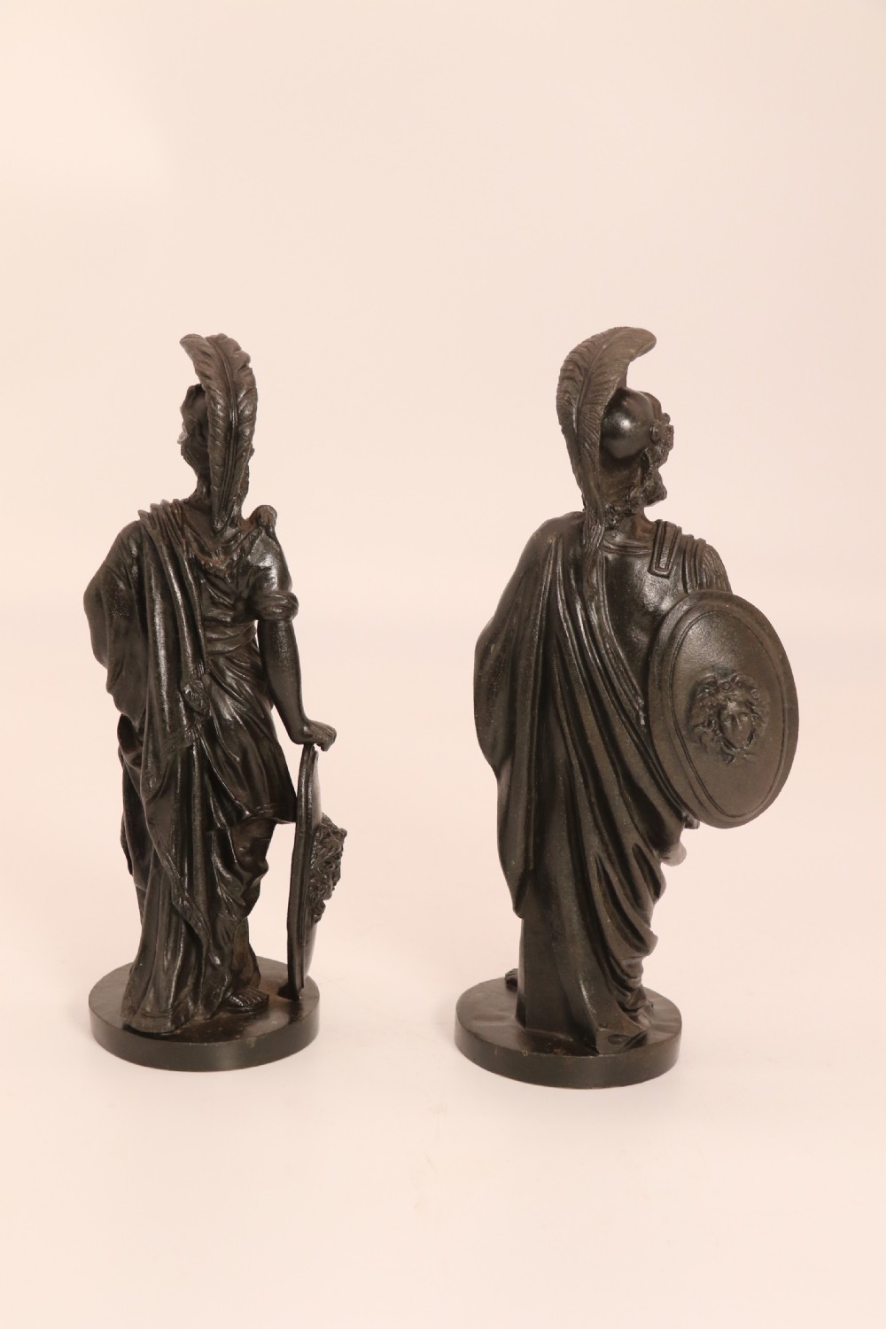 A pair of dark patinated bronze classical figures depicting Athena and Zeus on circular bases. View V