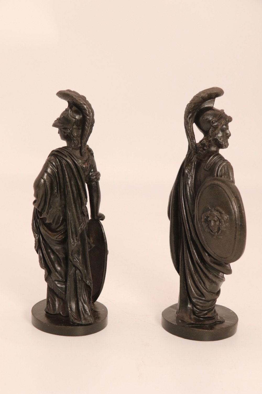 A pair of dark patinated bronze classical figures depicting Athena and Zeus on circular bases. View VI