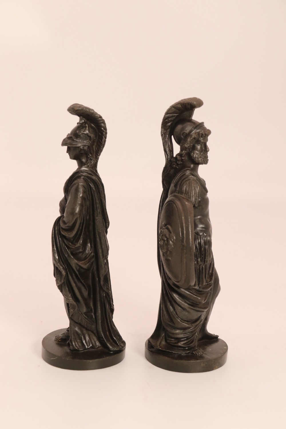 A pair of dark patinated bronze classical figures depicting Athena and Zeus on circular bases. View IX