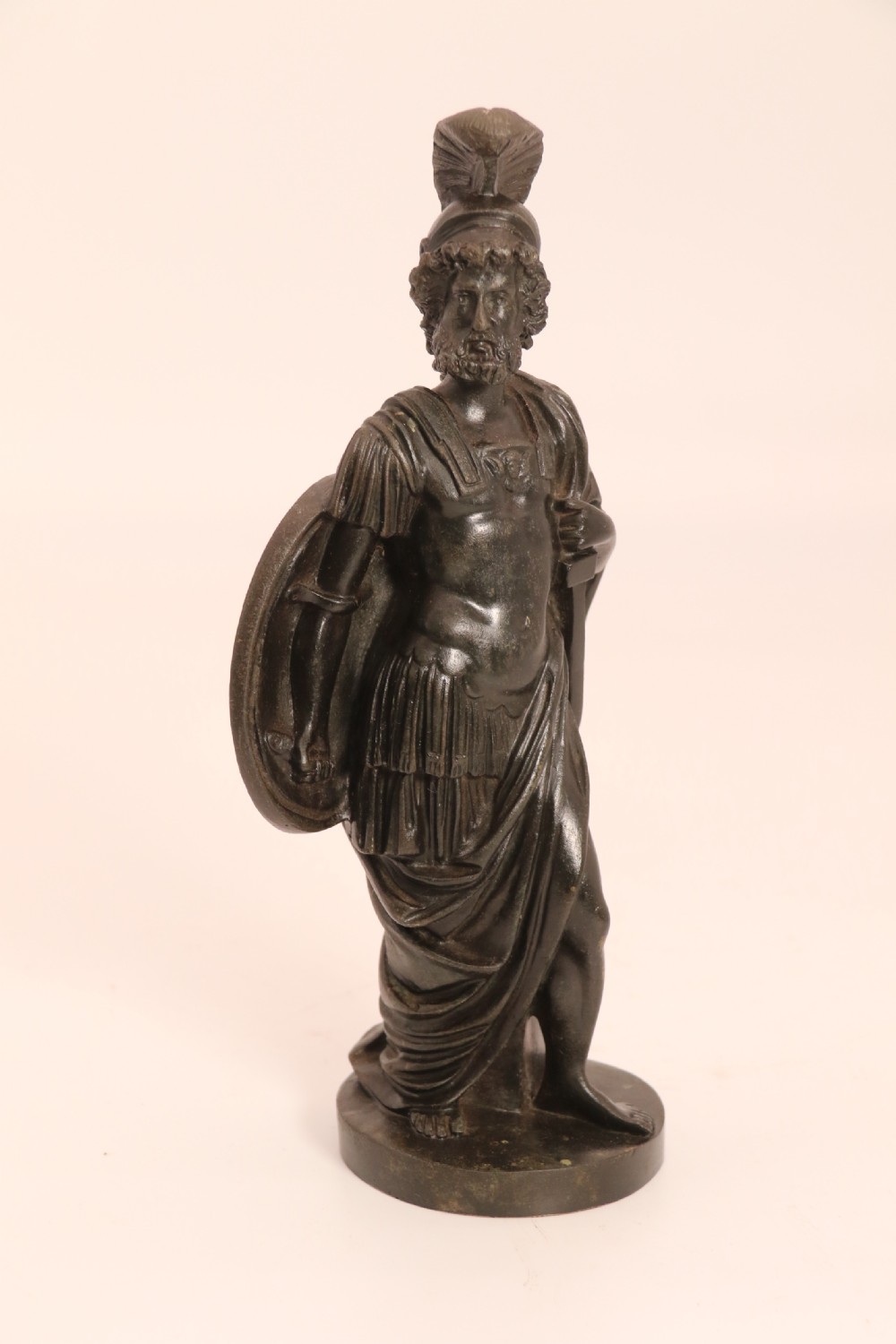 A pair of dark patinated bronze classical figures depicting Athena and Zeus on circular bases. View X