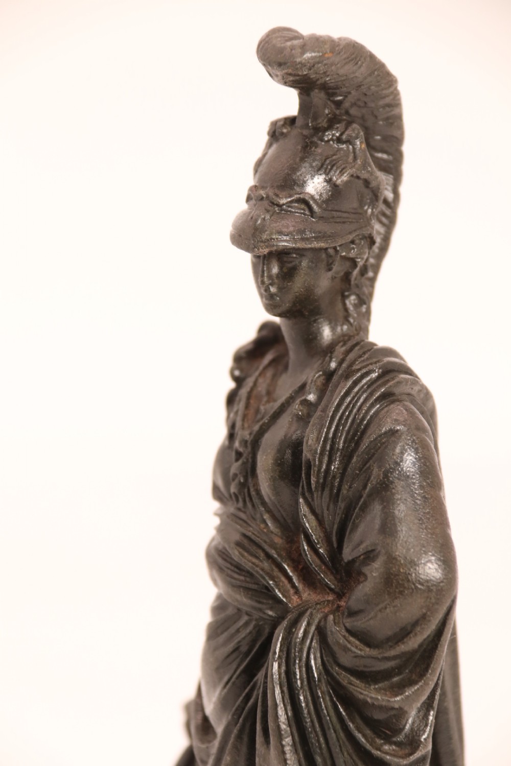 A pair of dark patinated bronze classical figures depicting Athena and Zeus on circular bases. View XXX