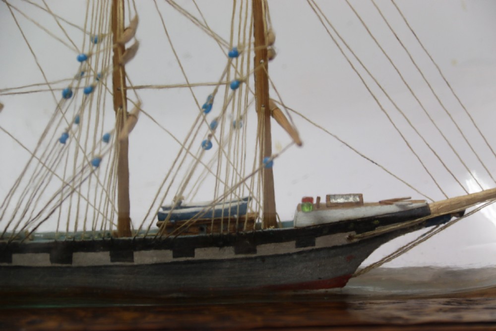 A rare pair of early 20th century model sailing ships in bottles displayed on wooden stands View XII