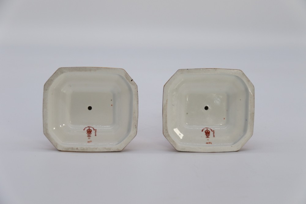 A rare pair of Royal Crown Derby hand painted porcelain candle sticks.

 View VII