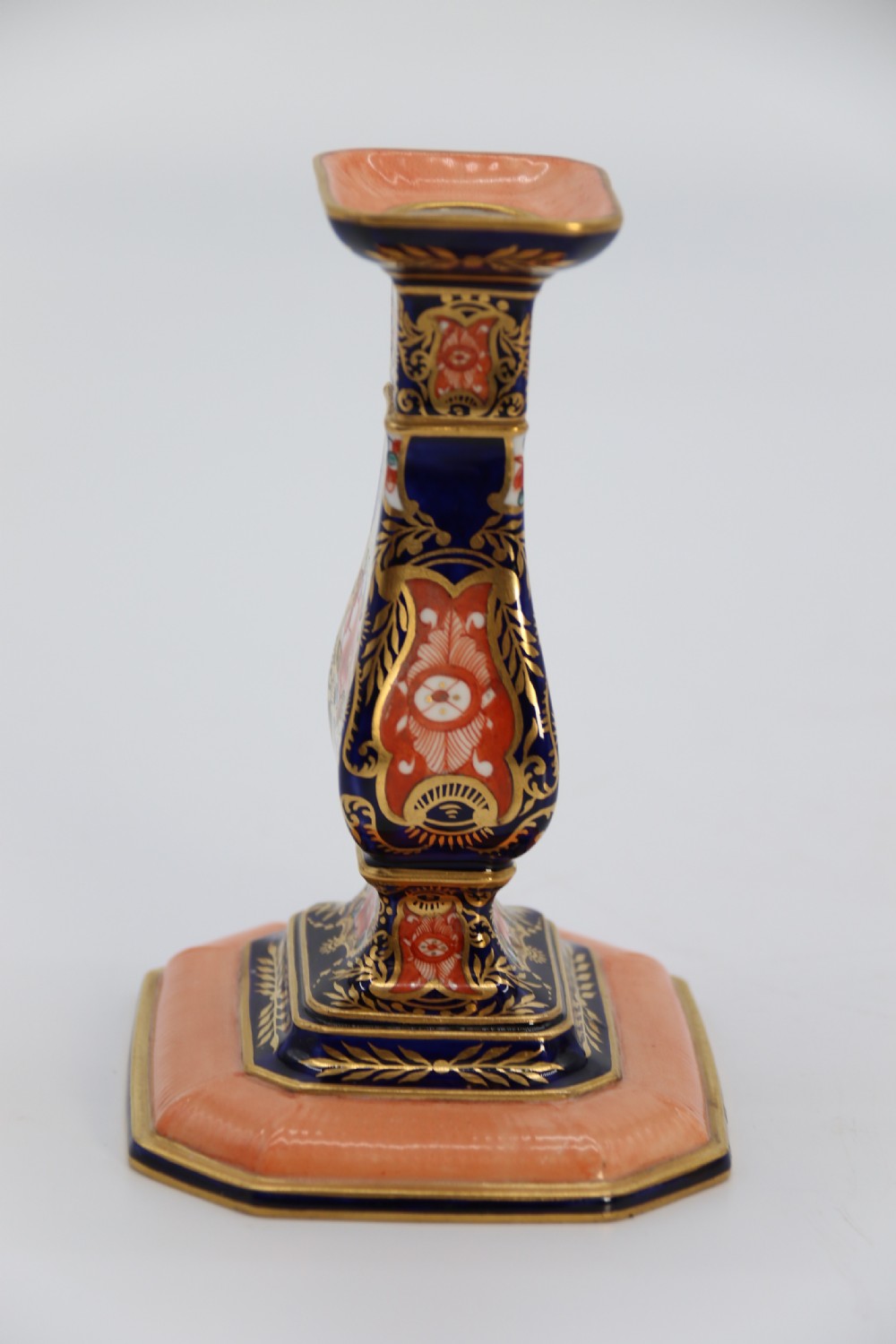 A rare pair of Royal Crown Derby hand painted porcelain candle sticks.

 View X