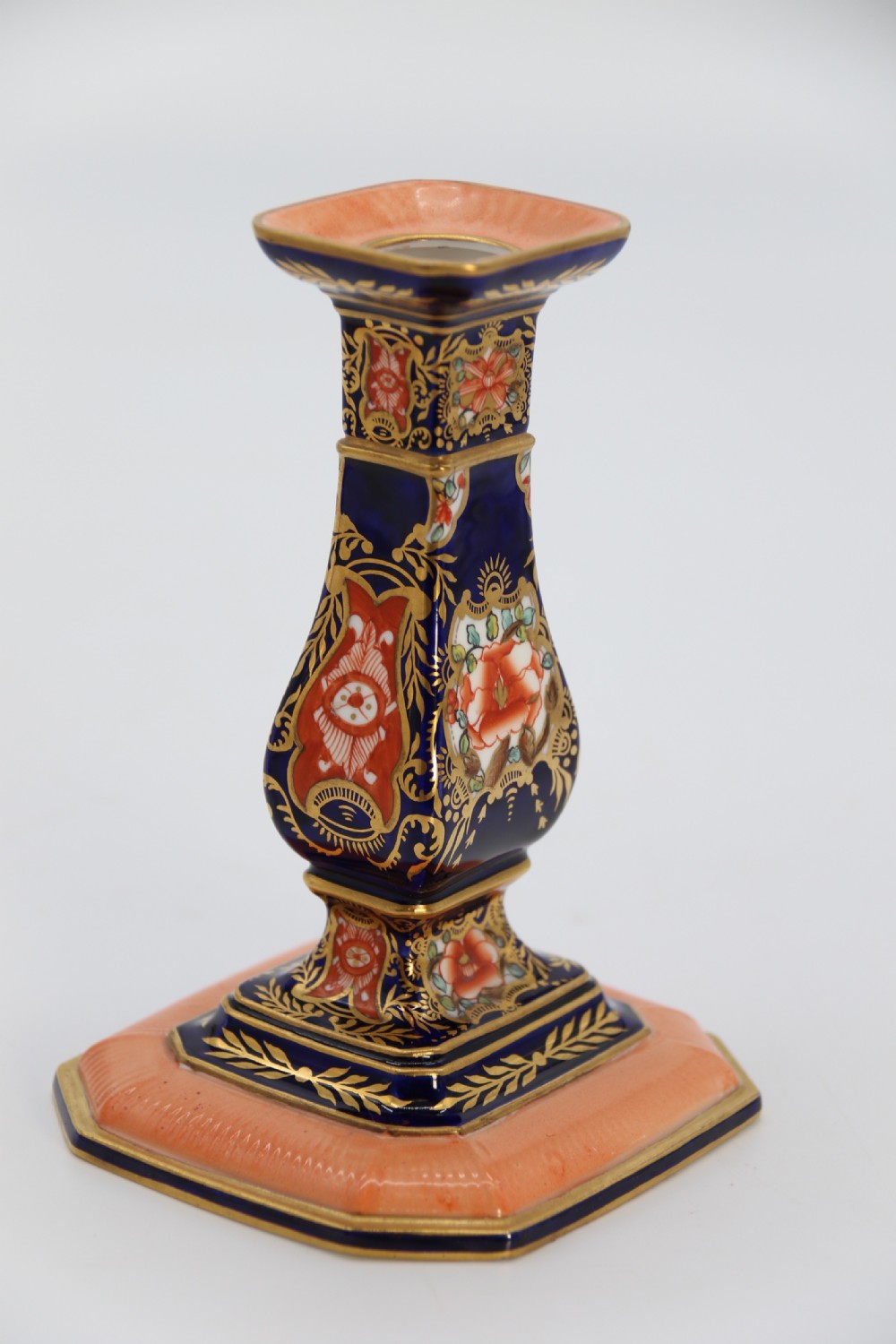 A rare pair of Royal Crown Derby hand painted porcelain candle sticks.

 View XII