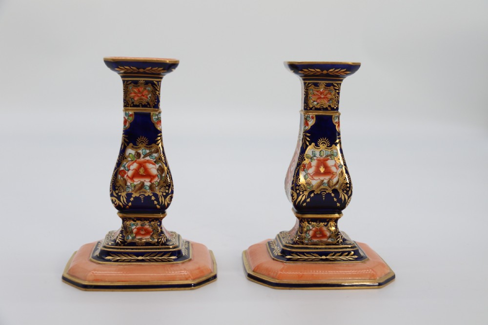 A rare pair of Royal Crown Derby hand painted porcelain candle sticks.

 View XIV
