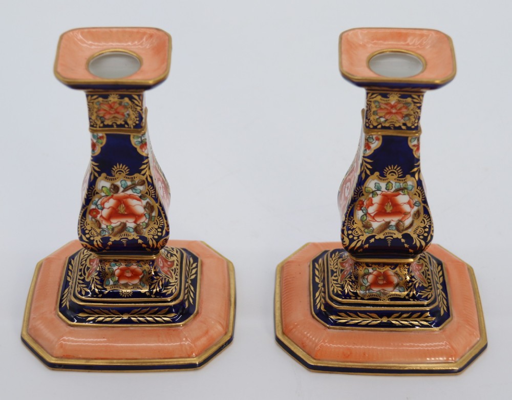A rare pair of Royal Crown Derby hand painted porcelain candle sticks.

 View XV