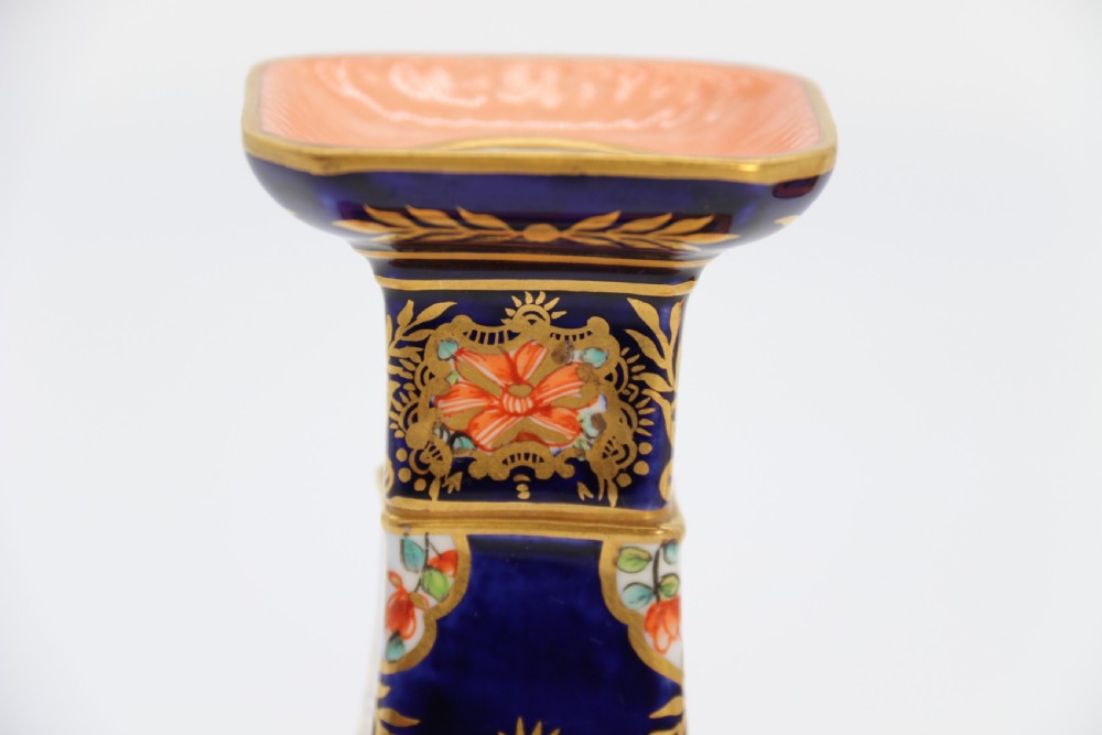 A rare pair of Royal Crown Derby hand painted porcelain candle sticks.

 View XVII