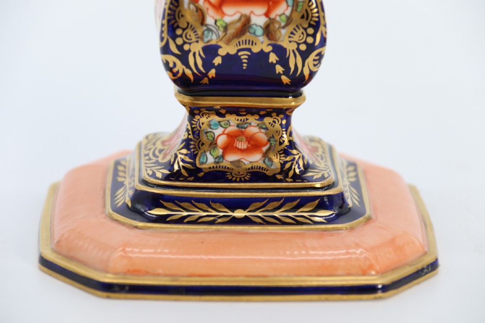 A rare pair of Royal Crown Derby hand painted porcelain candle sticks.

 View XVIII