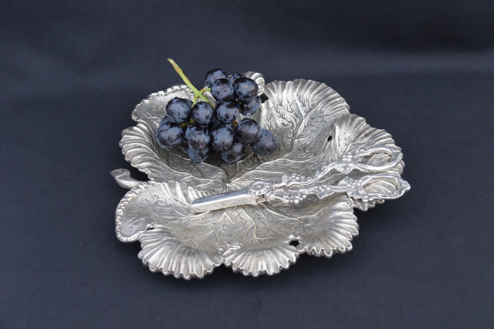 A rare late 19th century silver plated and hand engraved grape salver with matching grape scissors. View XVIII