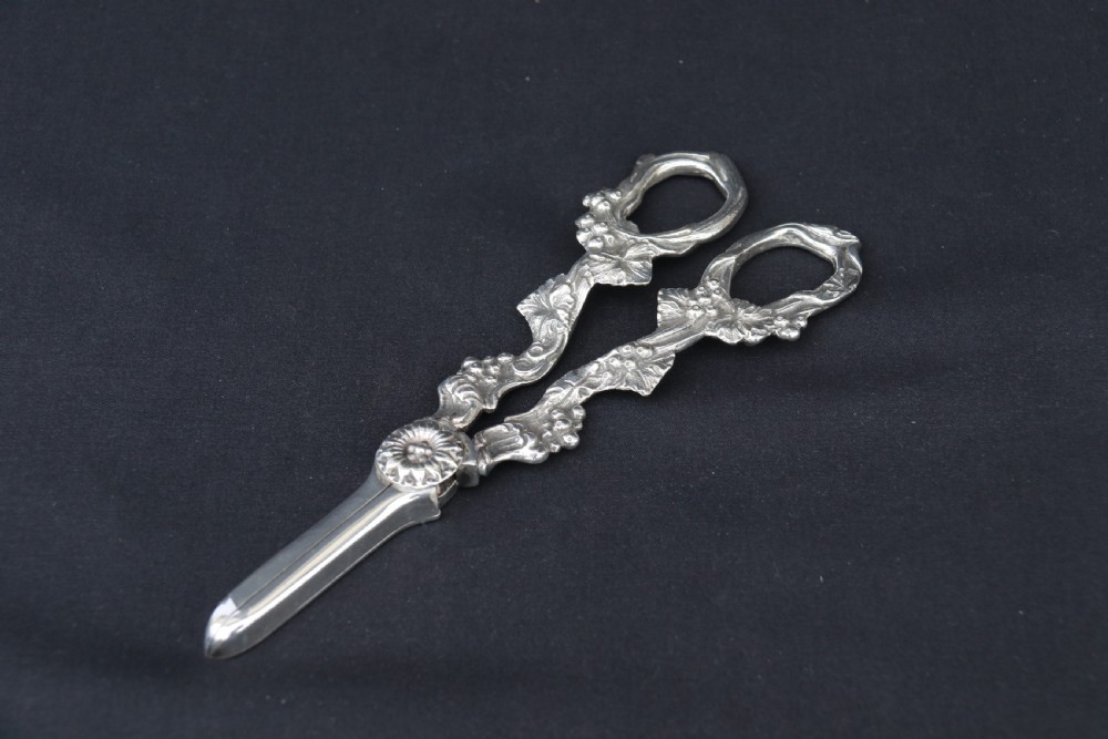 A rare late 19th century silver plated and hand engraved grape salver with matching grape scissors. View XXII