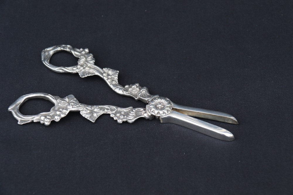 A rare late 19th century silver plated and hand engraved grape salver with matching grape scissors. View XXIII
