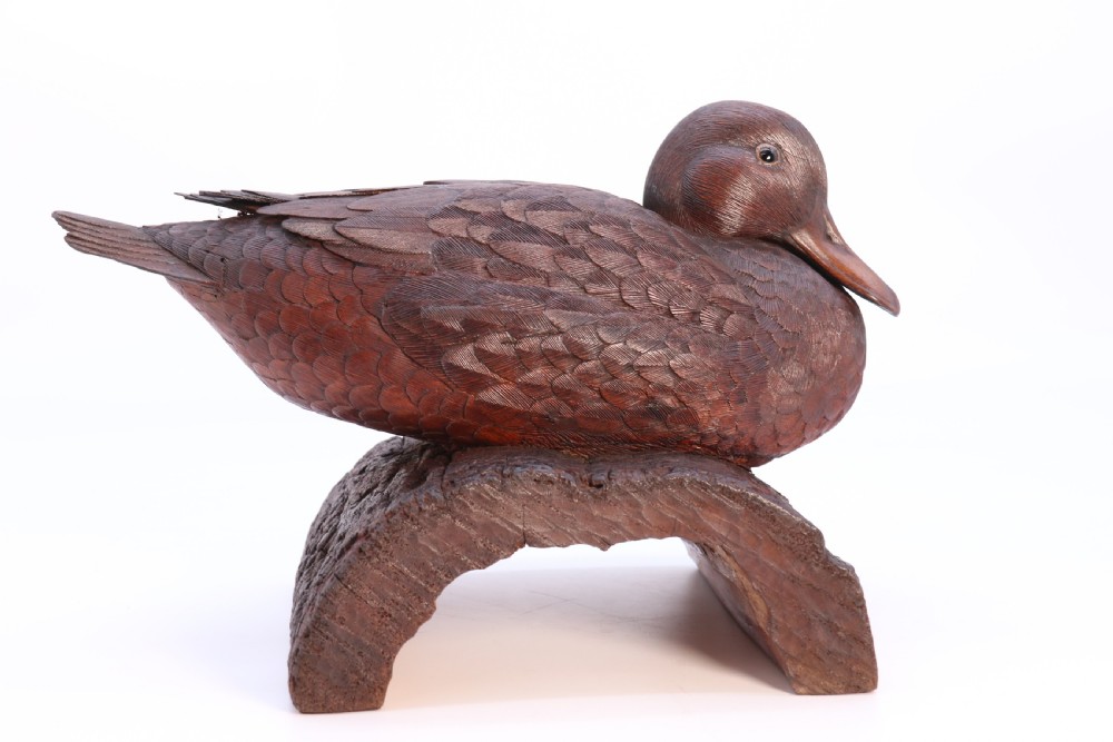 A superb Black Forest carved linden wood study of  a perched mallard duck.

 View X