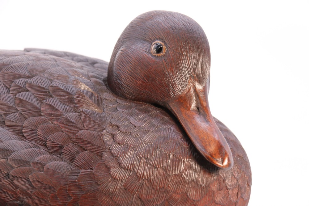 A superb Black Forest carved linden wood study of  a perched mallard duck.

 View XVIII