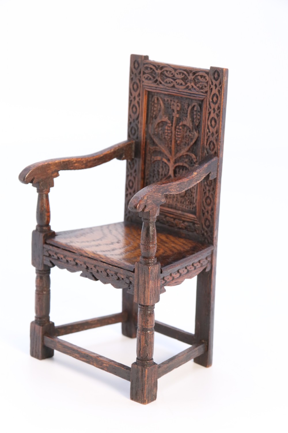 An exceptional miniature country oak panelled and carved wainscot armchair, circa 1900

 View III