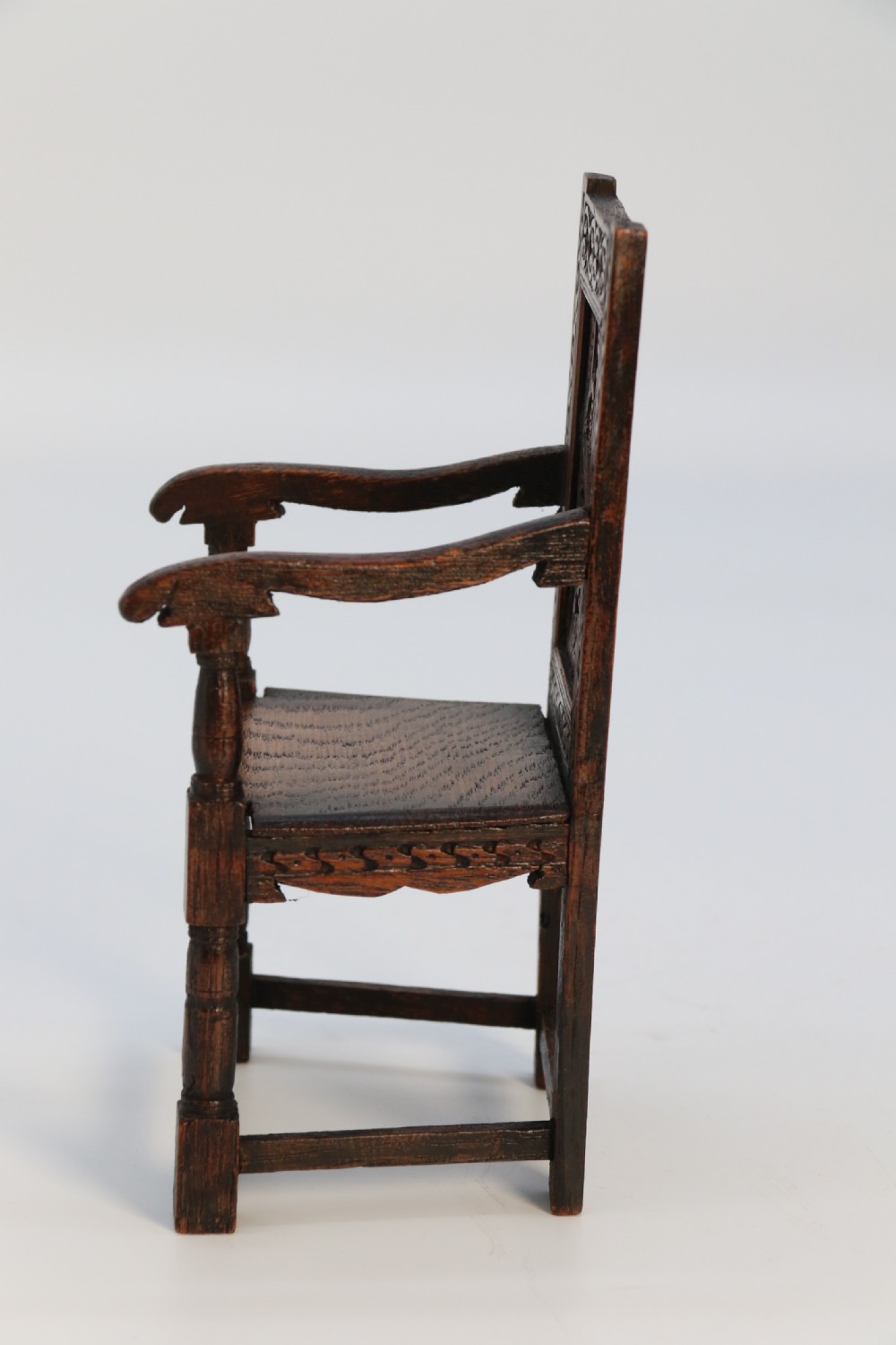 An exceptional miniature country oak panelled and carved wainscot armchair, circa 1900

 View IV