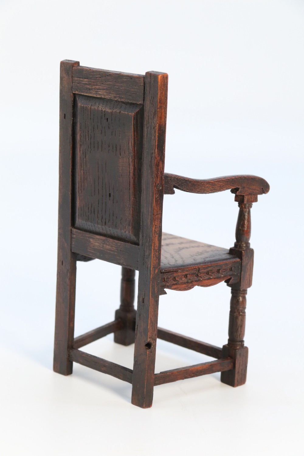 An exceptional miniature country oak panelled and carved wainscot armchair, circa 1900

 View VI