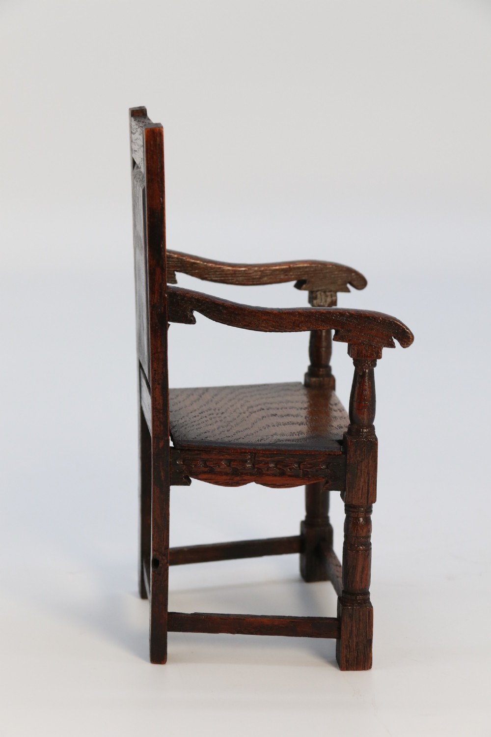 An exceptional miniature country oak panelled and carved wainscot armchair, circa 1900

 View VII