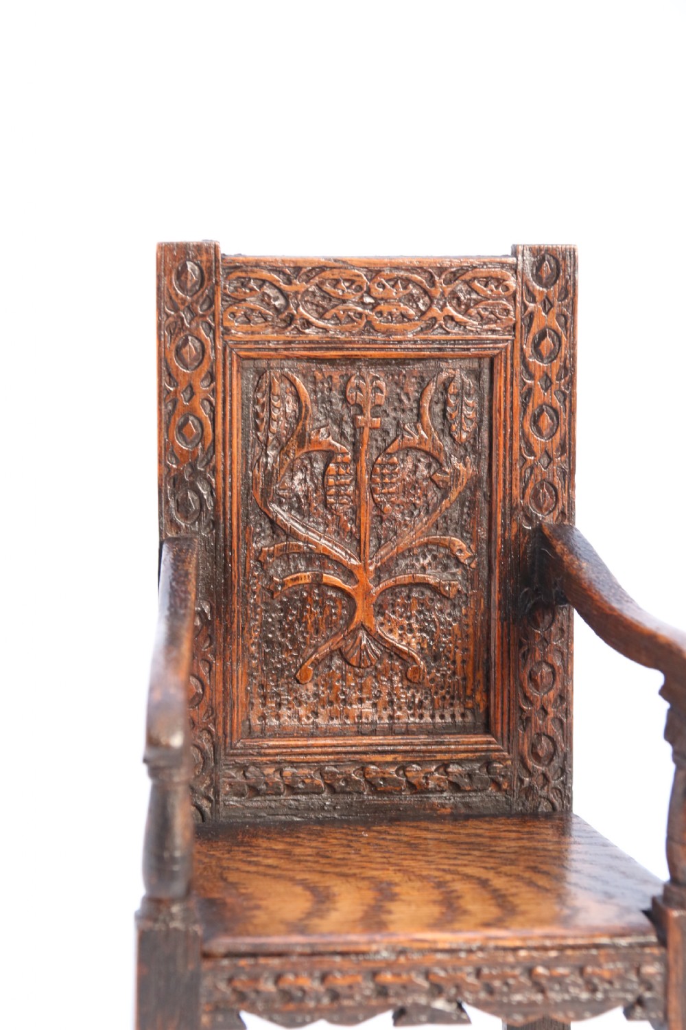 An exceptional miniature country oak panelled and carved wainscot armchair, circa 1900

 View IX