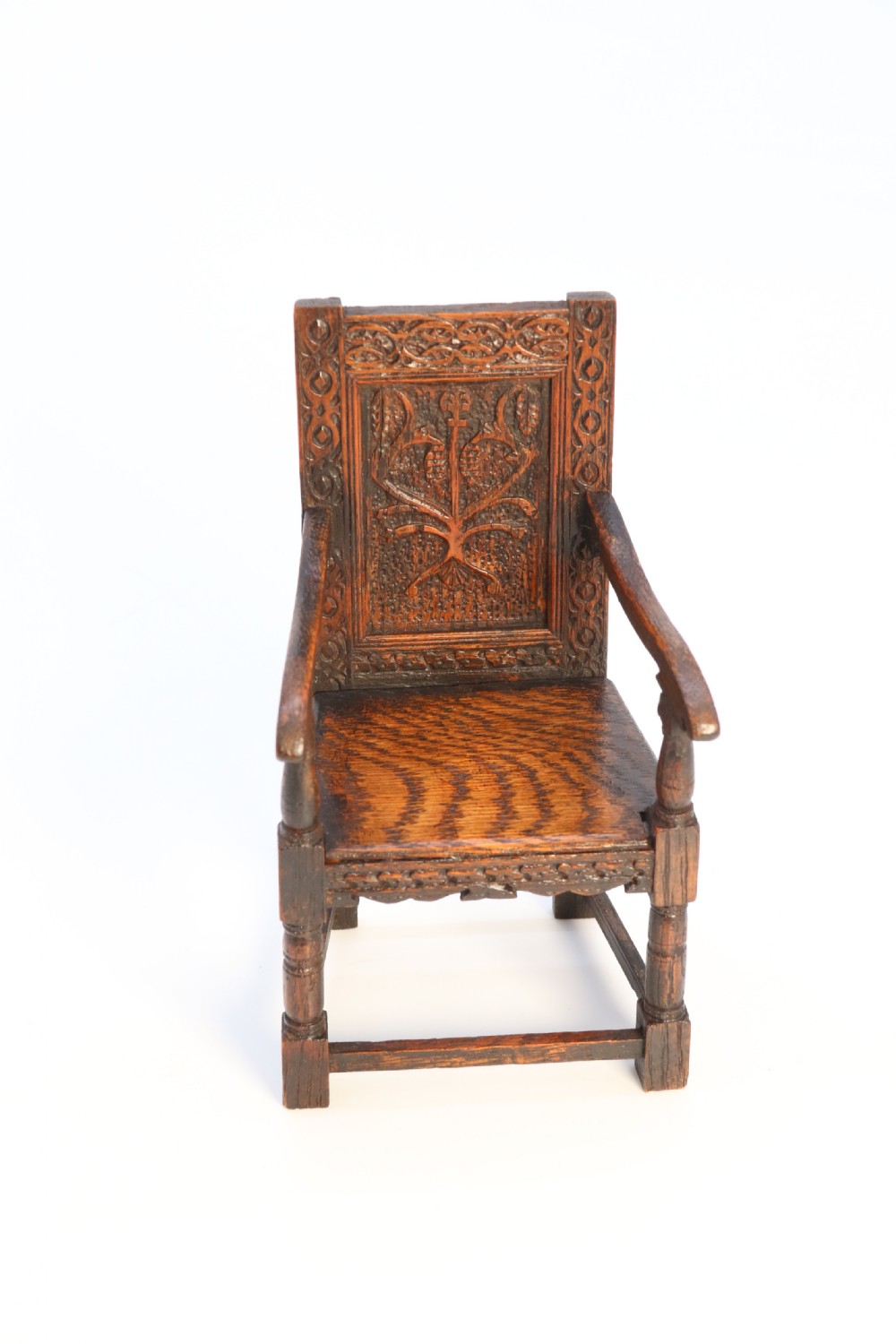 An exceptional miniature country oak panelled and carved wainscot armchair, circa 1900

 View XV