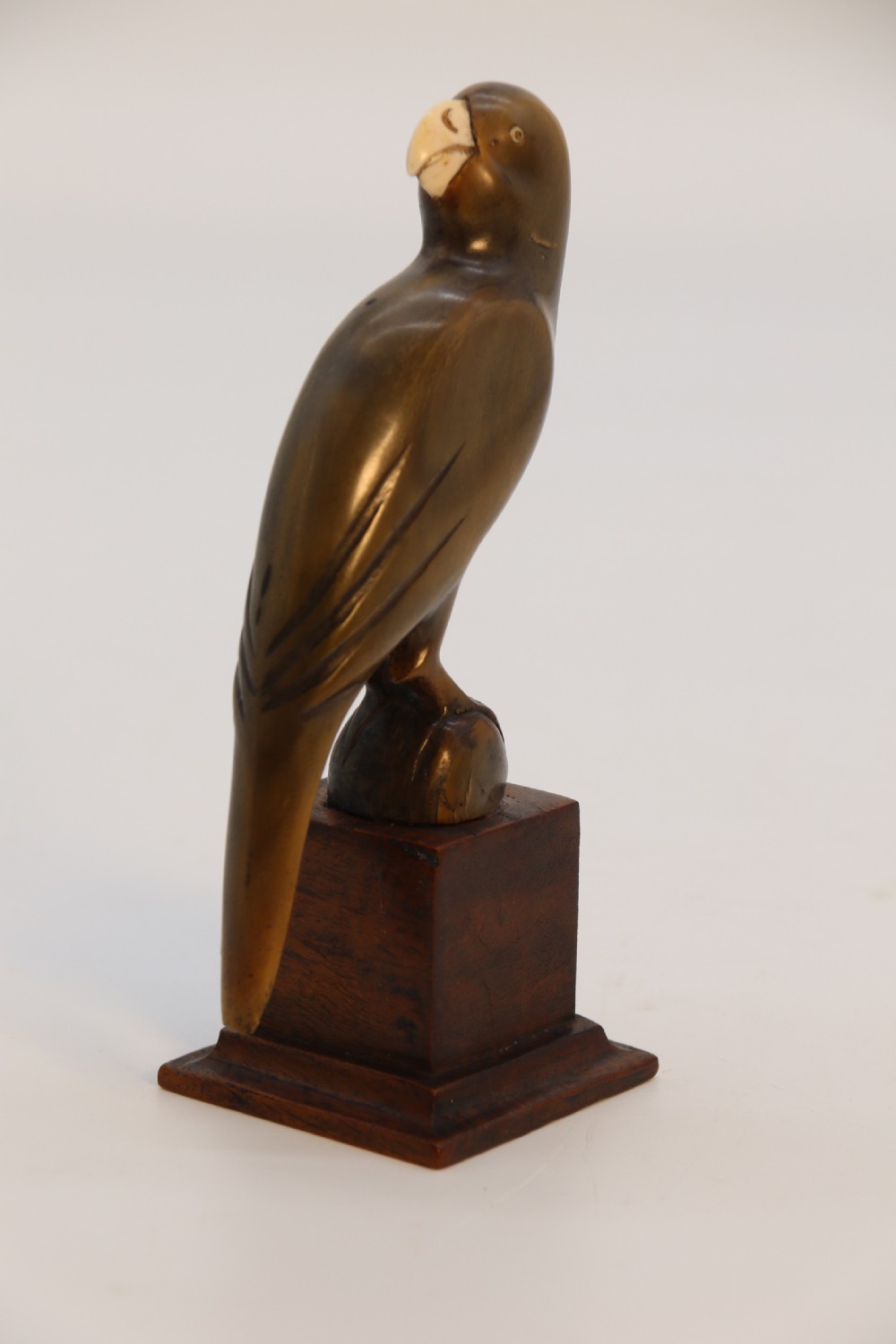 An Indian Raj period pair of carved buffalo horn parrots on wooden stands, circa 1890

 View VI