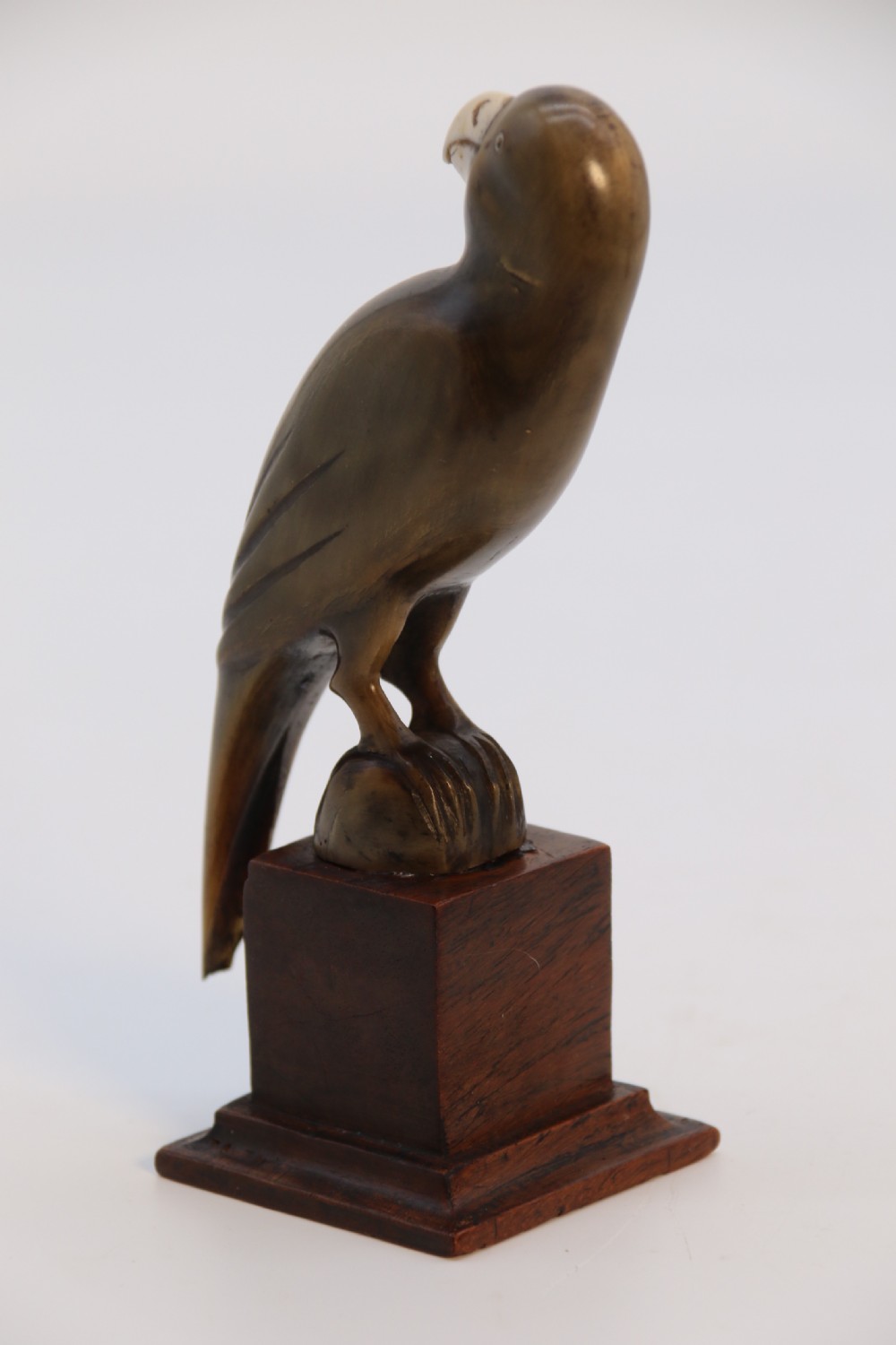 An Indian Raj period pair of carved buffalo horn parrots on wooden stands, circa 1890

 View VIII