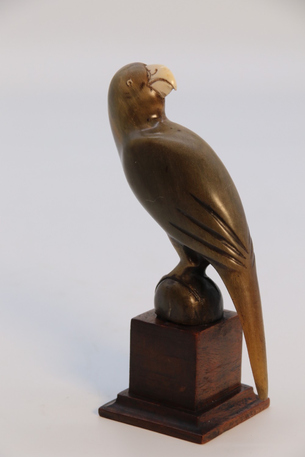An Indian Raj period pair of carved buffalo horn parrots on wooden stands, circa 1890

 View XIV