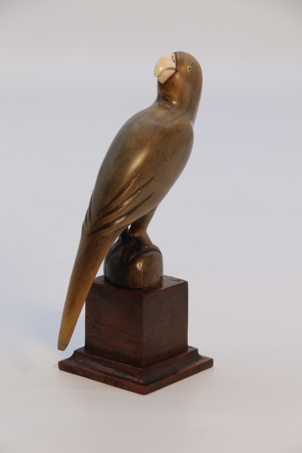 An Indian Raj period pair of carved buffalo horn parrots on wooden stands, circa 1890

 View XVI
