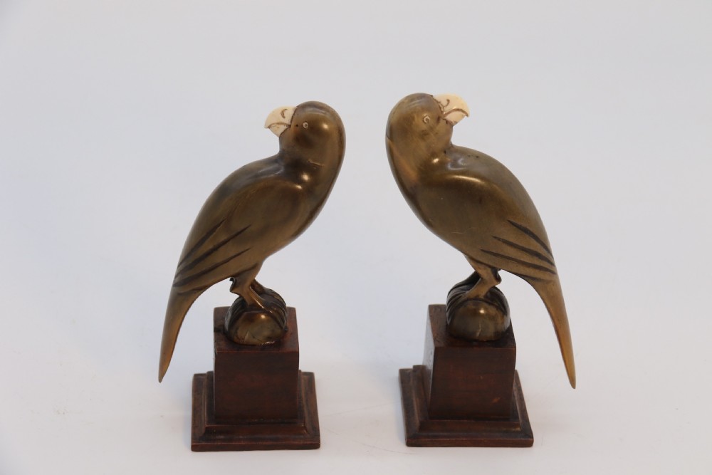 An Indian Raj period pair of carved buffalo horn parrots on wooden stands, circa 1890

 View XXVI