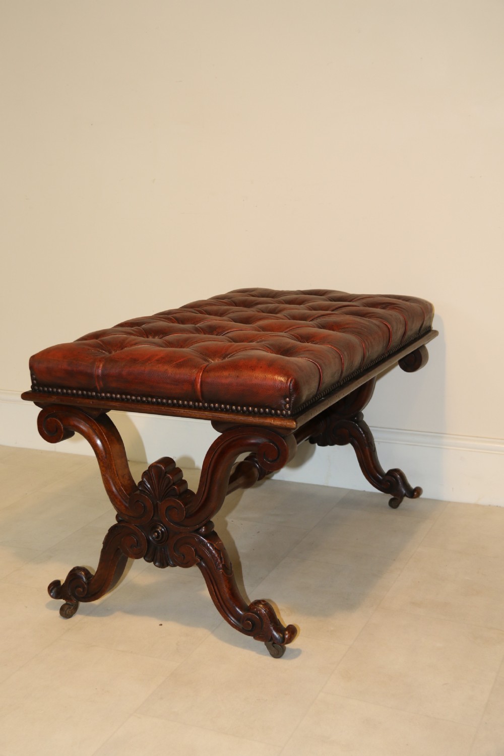 19th century large carved walnut and leather upholstered stool

 View V