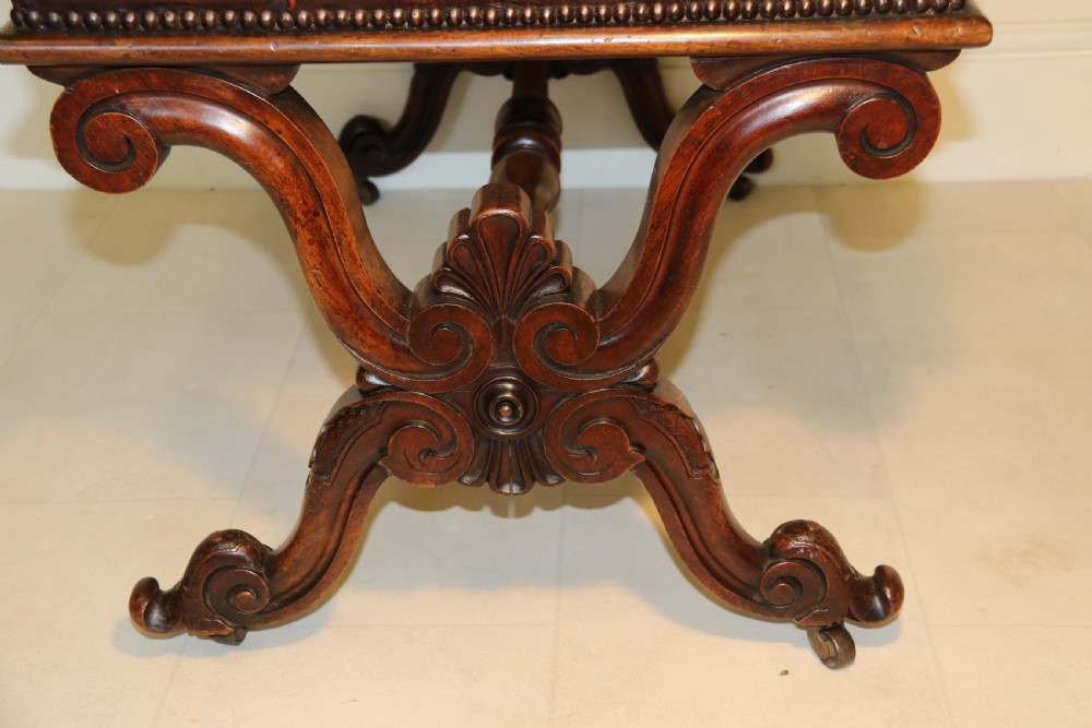 19th century large carved walnut and leather upholstered stool

 View IX