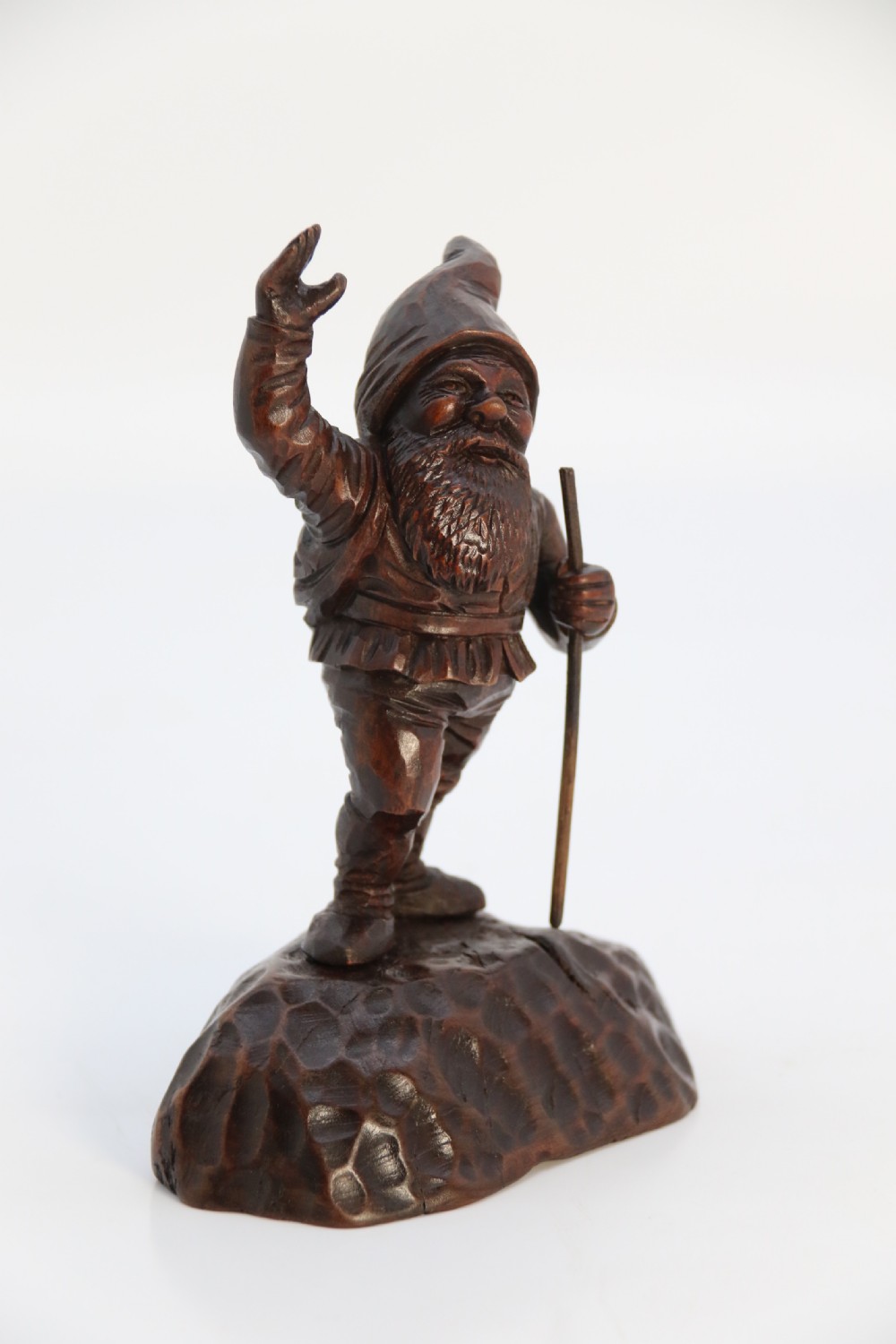 A rare late 19th century Black Forest carved walnut figure of a gnome View II