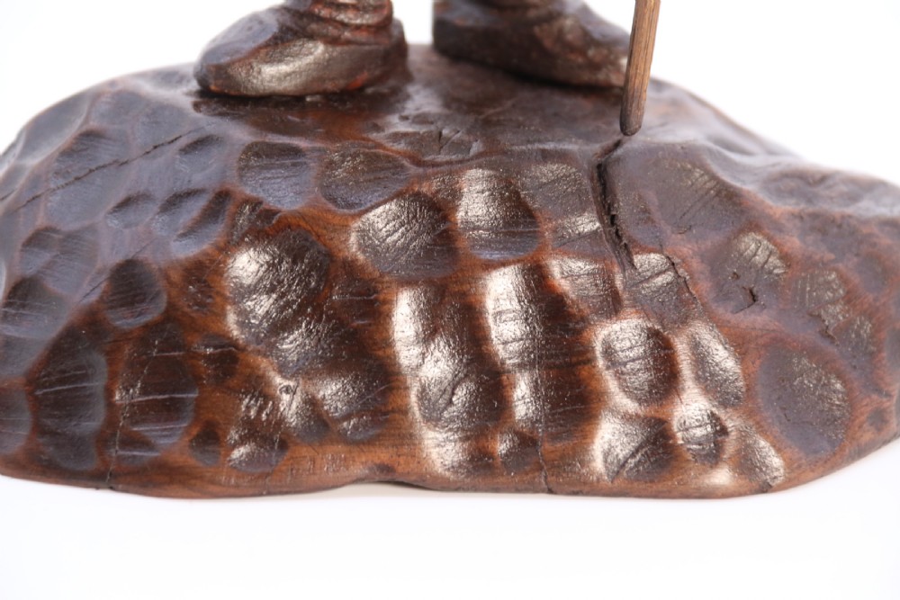 A rare late 19th century Black Forest carved walnut figure of a gnome View XIV