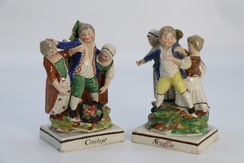 A rare pair of late 18th century English Staffordshire figure groups of two young men about to have a scuffle. View III