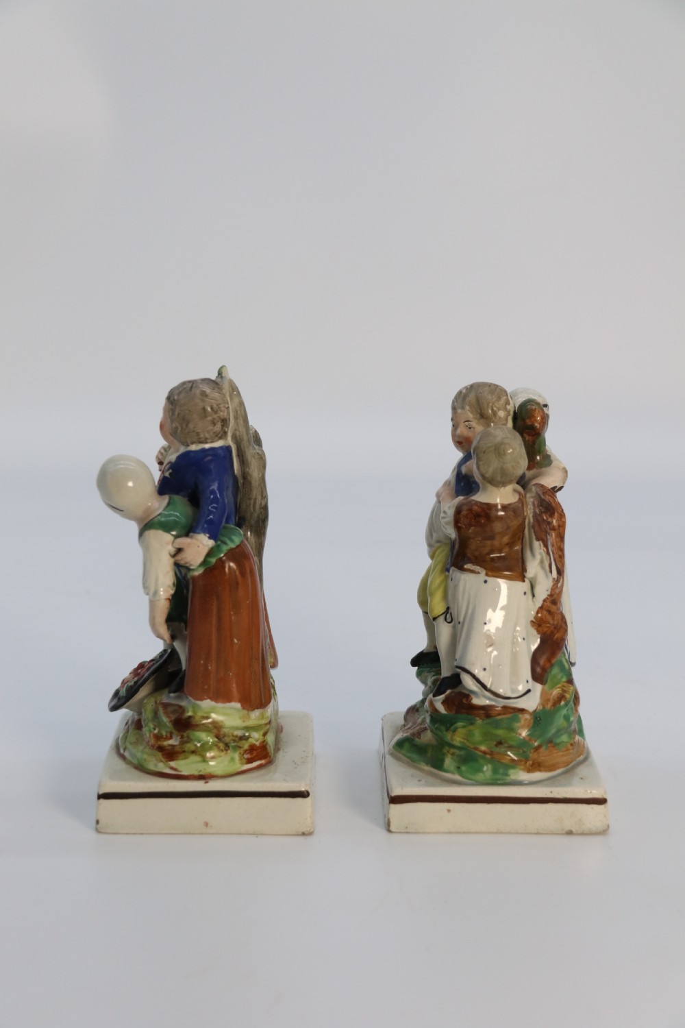 A rare pair of late 18th century English Staffordshire figure groups of two young men about to have a scuffle. View V