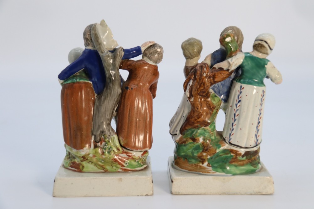 A rare pair of late 18th century English Staffordshire figure groups of two young men about to have a scuffle. View VI