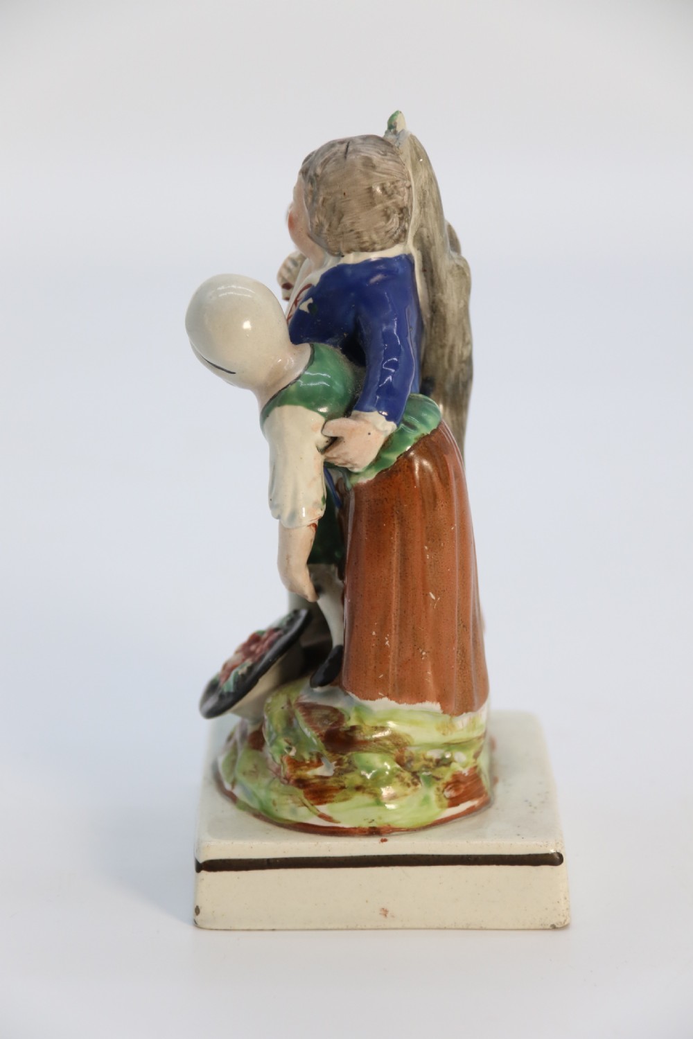 A rare pair of late 18th century English Staffordshire figure groups of two young men about to have a scuffle. View X