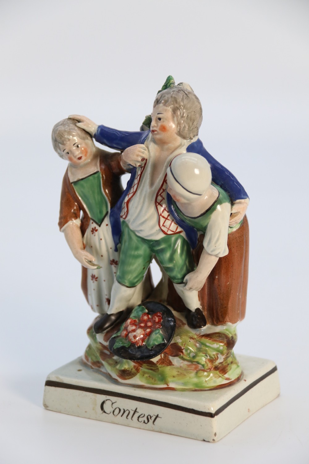 A rare pair of late 18th century English Staffordshire figure groups of two young men about to have a scuffle. View XIV