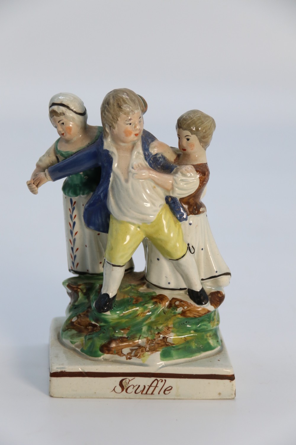 A rare pair of late 18th century English Staffordshire figure groups of two young men about to have a scuffle. View XV